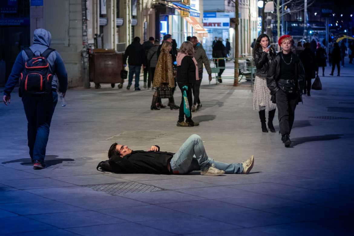 Nighttime nap on the sidewalk