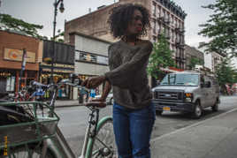 women in green bike