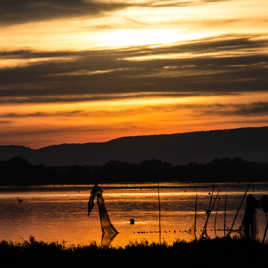 couché de soleil et filet de pèche